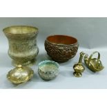 A hardwood bowl with silver plated rim carved in relief with four dragons amongst fruiting