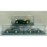 Three diecast and plastic Auto Art models of Jaguar cars: Jaguar XK8, etc, in original plastic