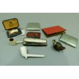 A silver mounted cigarette holder in original case, two EPNS cigarette cases and a vintage Ronson