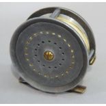 An English fly reel with pierced 10.5cm spool with bronzed foot and ivorine handle