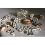 A collection of costume jewellery including dress rings, a coin bracelet, bangle and two trace
