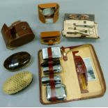 A gentleman's leather toiletry case, gentleman's leather case containing shaving and manicure items,