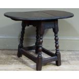 An old reproduction oak drop leaf table on splayed bobbin turned legs by stretchers, 64cm wide