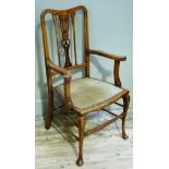 An Edwardian polished beech and inlaid open armchair with upholstered seat on slender cabriole legs