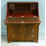 A reproduction mahogany bureau