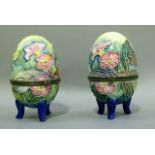 A pair of Old Tupton ware egg shaped trinket boxes each tube lined and painted with trailing flowers