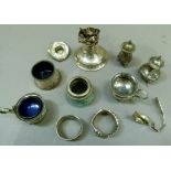 Items of silver cruet ware mainly with faults, a candle stick at fault, napkin ring, spoon etc,