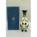 An Old Tupton ware vase of baluster form tube lined and enamelled with orchid, 25cm high, with