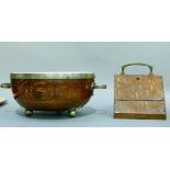 An silver plate mounted oak fruit bowl with twin handles and on ball feet complete with ceramic