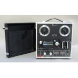 An Akai model 1721L four track stereophonic reel to reel tape recorder, serial no H-70903-01353