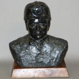 JAMES STEWART (20th century), coal, head and shoulders sculpture of a miner with helmet,