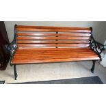 A cast iron and rail garden bench