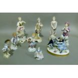 A collection of mainly Continental china figures of 18th and 19th century dress, figure group in