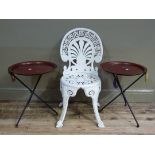 A pair of tole circular folding occasional tables, the brown ground painted with a circle of