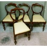 A set of four mahogany balloon back dining chairs