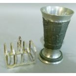 An Elizabeth II silver toast rack, Birmingham 1965, 7cm wide and a German pewter beaker.