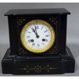 A Victorian black slate mantel clock with white enamel dial 25cm wide