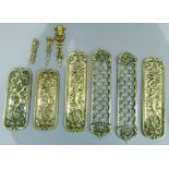 A collection of brass door plates