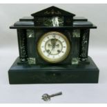 A Victorian black slate mantel clock of architectural design with two piece dial, black Roman