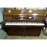 A modern mahogany cased mini piano by Barrett and Robinson of London, overstrung metal frame,