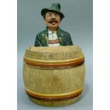 A 19th century Austrian pottery tobacco jar and cover modelled as a gentleman in Tyrolean dress