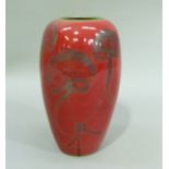 A red flambe vase of ovoid form, decorated with flowers, 20cm high