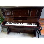 A late Victorian mahogany cased piano by Adalbert Berlin, inlaid to the case with metal and mother