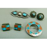 A pair of mid 20th century turquoise set earrings in silver, each collet set to the centre with a