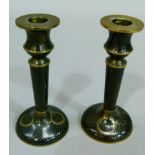 A pair of black ground cloisonne candlesticks, 14.5cm high