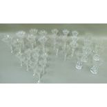 A suite of vine etched table glass with air twist stems comprising seven water glasses, seven