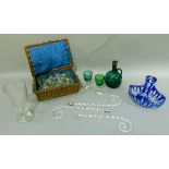 A Victorian green glass decanter and pair of wine glasses, together with a blue overlaid clear glass