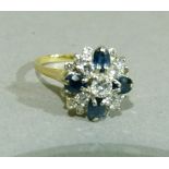 A sapphire and diamond cluster ring c.1970 claw set to the centre with a brilliant cut diamond
