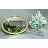 An early 20th century oval wall mirror in gilt beaded and gadroon frame, 82cm x 58cm together with a