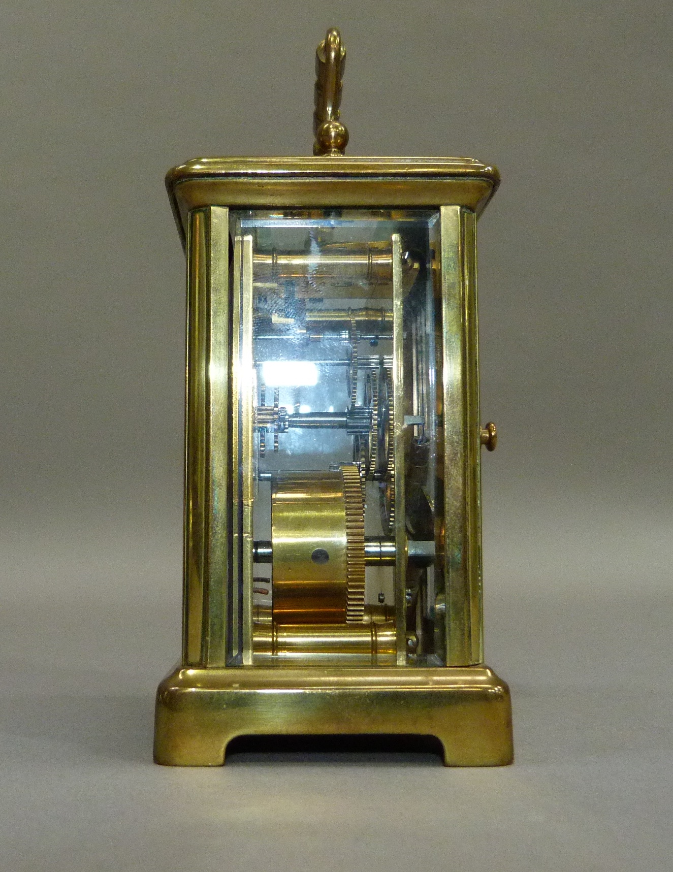 A brass carriage clock with key, white enamelled dial with black Roman numerals, 15cm overhandles - Image 2 of 4