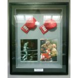 Henry Cooper and Frank Bruno - a display frame containing two gloves signed by the boxers,