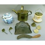 A brass hot water can, a embossed metal crumb scoop and associated brush and two pottery biscuit
