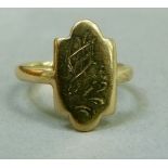 An Edward VII dress ring in 9ct gold, the quatrefoil head with worn scroll engraving, approximate