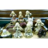 Three resin figures See no Evil, Hear no Evil, Speak no Evil; together with another set seated on