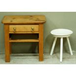 A pine single drawer table on rectangular legs, 56cm wide; together with a white painted dished