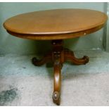 A Victorian mahogany oval tilt top breakfast table on a turned column with three legs
