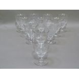 A set of ten water glasses cup the lower bowl ribbed and on circular foot