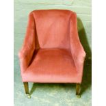 An Edward VII chair upholstered in dark pink velvet on square tapered legs fitted with brass sockets