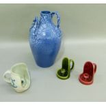 A Continental blue glaze earthenware two handled flagon/vase, together with two pottery candle