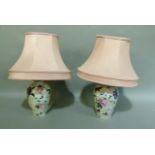 A pair of floral decorated pottery table lamps, 19cm high