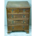 An oak chest of two short and three long graduated cockbeaded drawers, ogee feet, 59cm wide, early