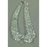 An early 20th century rock crystal necklace the graduated faceted tubular beads on wire (a/f)