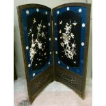 A Japanese Meiji period two fold draught screen, the lacquered panel painted and inlaid with