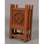 An American oak Sessions clock, the square panel having applied black Arabic numerals, in railed