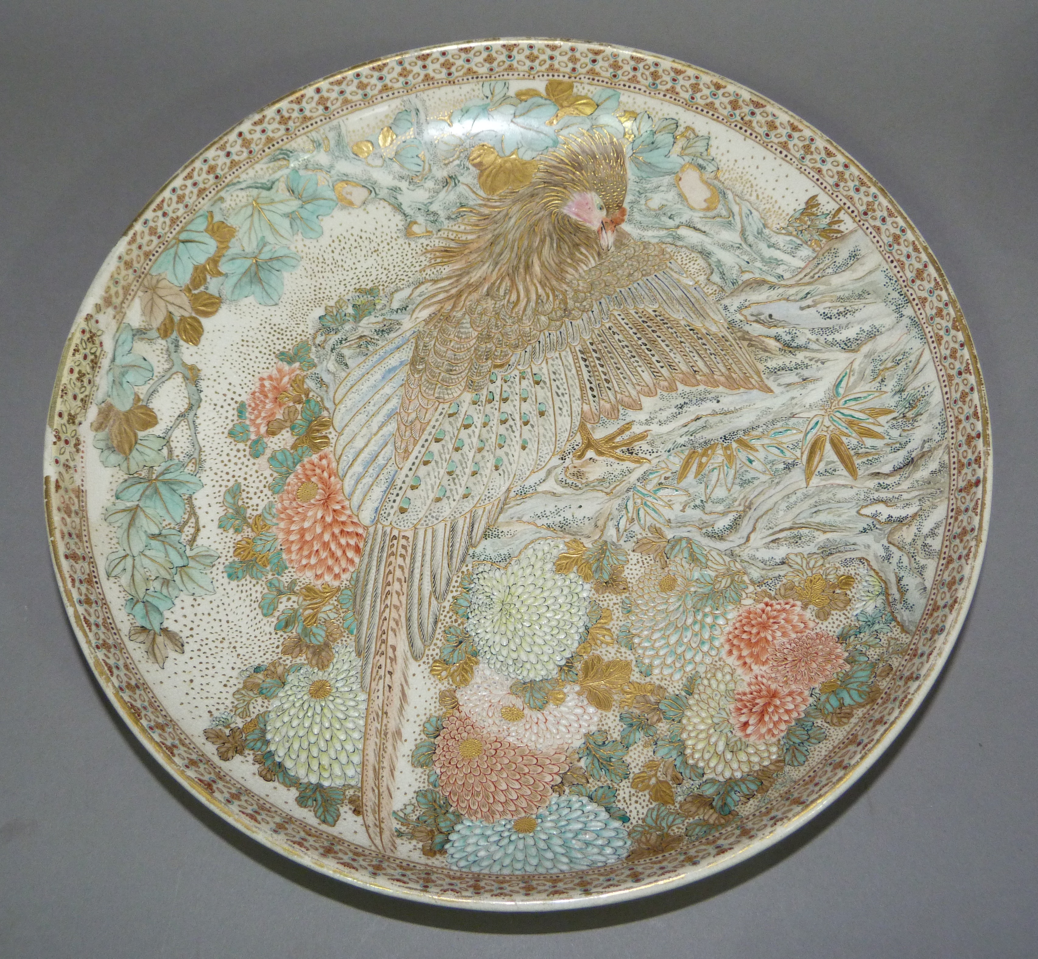 A Japanese Satsuma charger decorated with an exotic bird amidst chysanthemums, 31cm diameter - Image 2 of 6