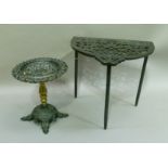 A Victorian cast iron and brass trivet the circular top on baluster column and on four feet together